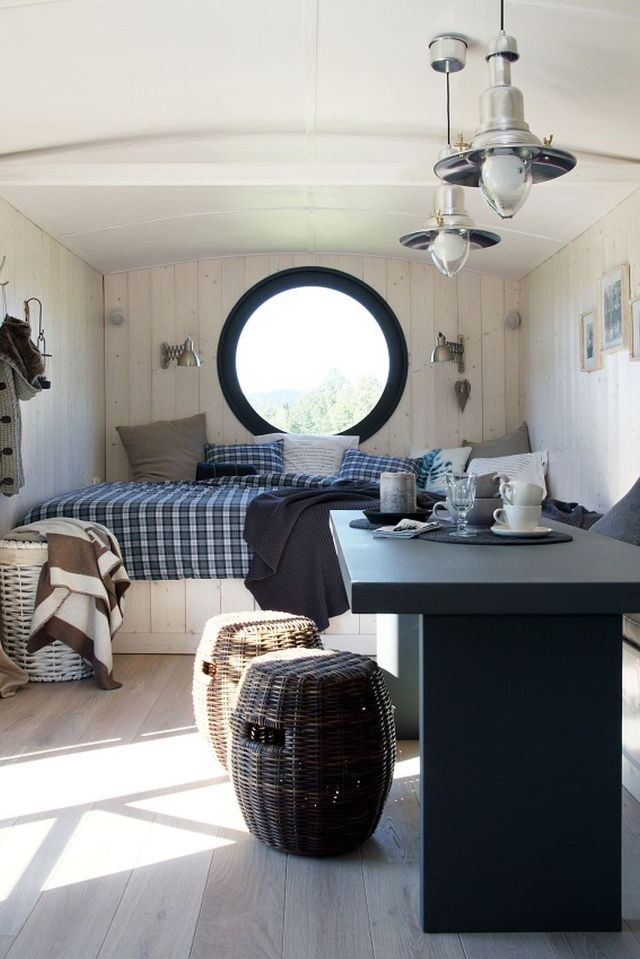 A modern version of the traditional wagon dwelling. It has a full kitchen, 3-piece bath and built-in bed in 258 sq ft. | www.facebook.com/SmallHouseBliss