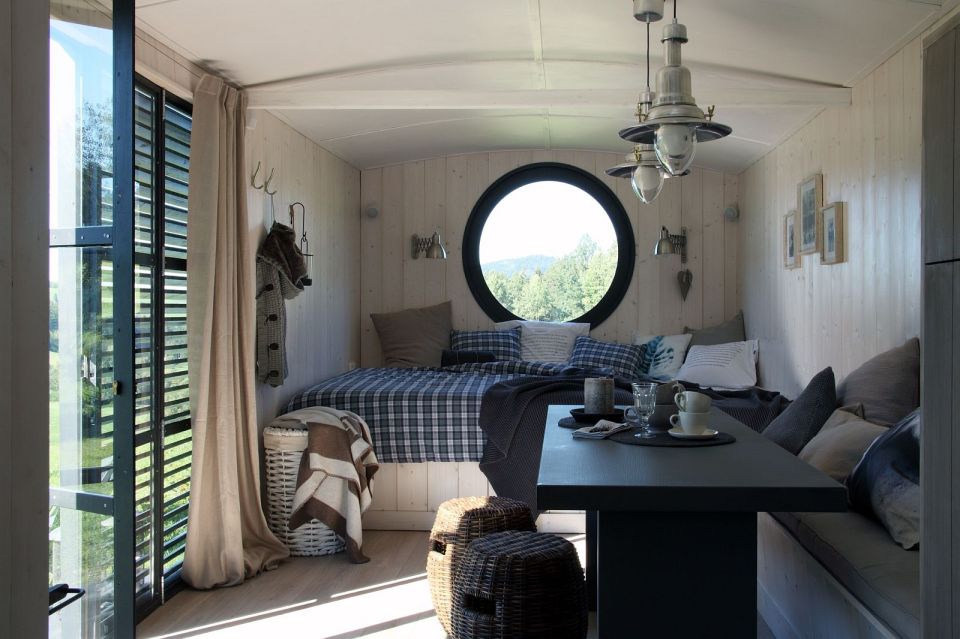 A modern version of the traditional wagon dwelling. It has a full kitchen, 3-piece bath and built-in bed in 258 sq ft. | www.facebook.com/SmallHouseBliss
