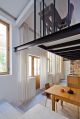 A dingy workshop in Paris was transformed into this bright and airy home with a glass-enclosed loft. | www.facebook.com/SmallHouseBliss