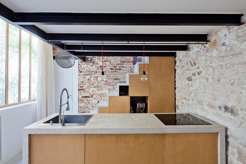 A dingy workshop in Paris was transformed into this bright and airy home with a glass-enclosed loft. | www.facebook.com/SmallHouseBliss