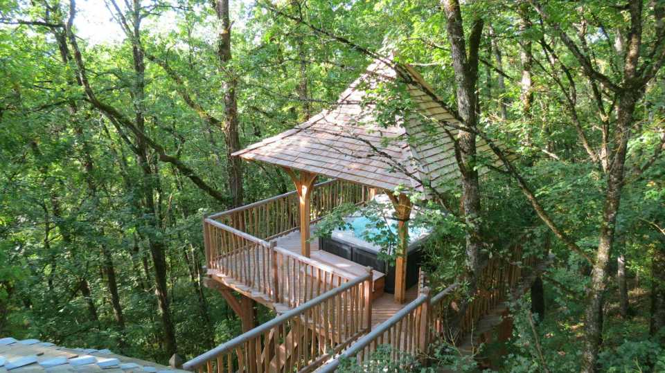 Cabane Hautefort at Châteaux Dans Les Arbres is a luxury treehouse with 3 bedrooms and a full kitchen and bath in 603 sq ft. | www.facebook.com/SmallHouseBliss