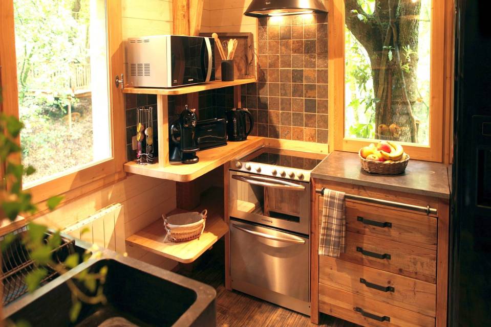 Cabane Hautefort at Châteaux Dans Les Arbres is a luxury treehouse with 3 bedrooms and a full kitchen and bath in 603 sq ft. | www.facebook.com/SmallHouseBliss