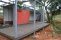 Nomad Living, a shipping container guest house that expands out to a shaded terrace. | www.facebook.com/SmallHouseBliss