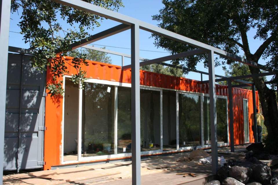 Nomad Living, a shipping container guest house that expands out to a shaded terrace. | www.facebook.com/SmallHouseBliss