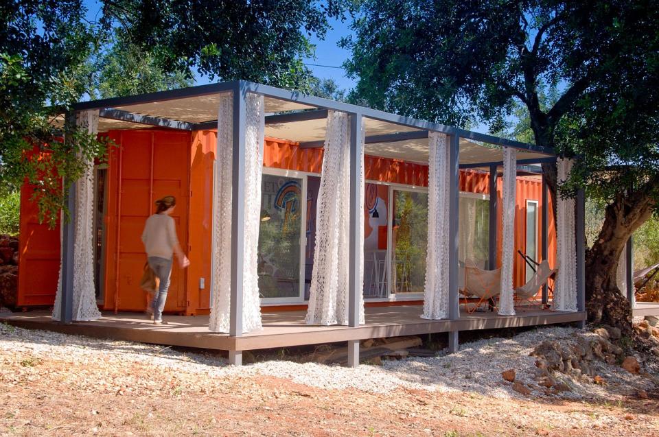 Nomad Living, a shipping container guest house that expands out to a shaded terrace. | www.facebook.com/SmallHouseBliss