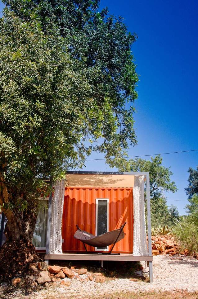 Nomad Living, a shipping container guest house that expands out to a shaded terrace. | www.facebook.com/SmallHouseBliss