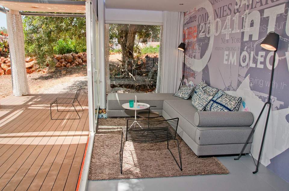 Nomad Living, a shipping container guest house that expands out to a shaded terrace. | www.facebook.com/SmallHouseBliss