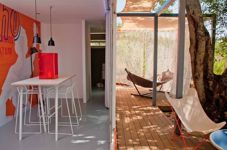Nomad Living, a shipping container guest house that expands out to a shaded terrace. | www.facebook.com/SmallHouseBliss