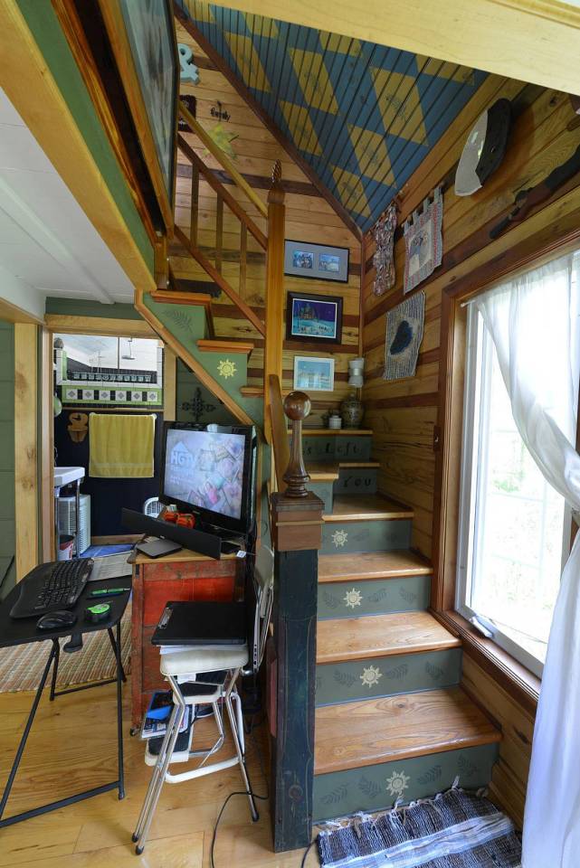 This tiny storybook cottage was handcrafted by its owner. It has 1 bedroom in 520 sq ft. | www.facebook.com/SmallHouseBliss