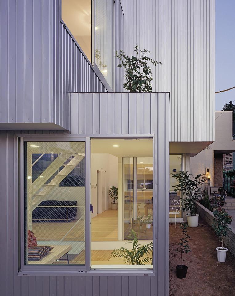 Boxy on the outside but extremely open on the inside, this small family house has 3 open bedrooms in 964 sq ft. | www.facebook.com/SmallHouseBliss