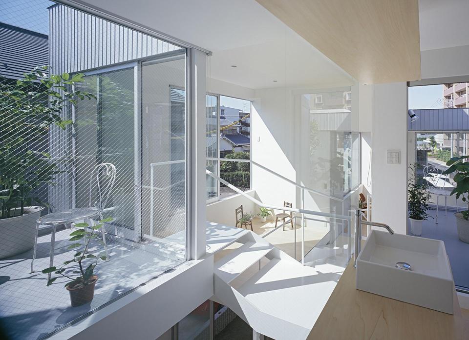 Boxy on the outside but extremely open on the inside, this small family house has 3 open bedrooms in 964 sq ft. | www.facebook.com/SmallHouseBliss