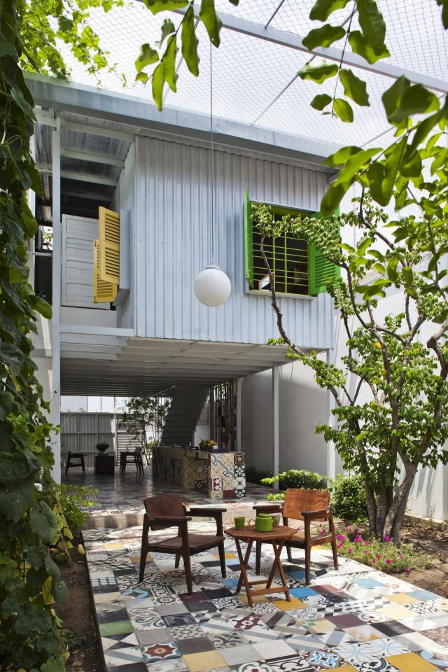 This small house in Vietnam has its ground floor living space open to the outdoors. It will eventually be covered by a screen of climbing plants. | www.facebook.com/SmallHouseBliss
