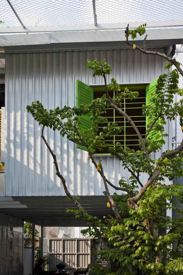 This small house in Vietnam has its ground floor living space open to the outdoors. It will eventually be covered by a screen of climbing plants. | www.facebook.com/SmallHouseBliss
