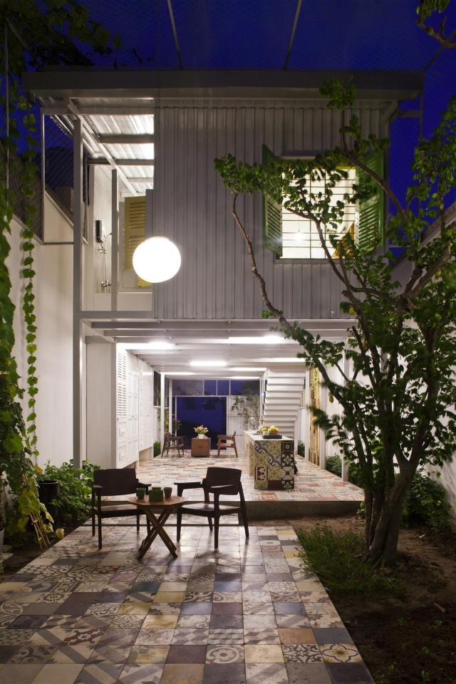 This small house in Vietnam has its ground floor living space open to the outdoors. It will eventually be covered by a screen of climbing plants. | www.facebook.com/SmallHouseBliss