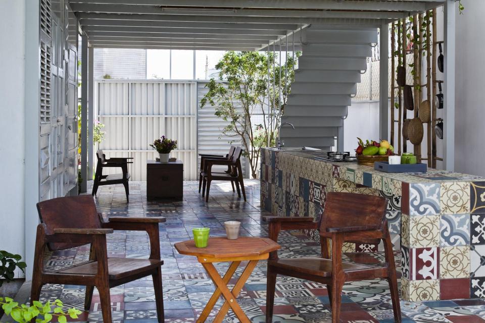 This small house in Vietnam has its ground floor living space open to the outdoors. It will eventually be covered by a screen of climbing plants. | www.facebook.com/SmallHouseBliss