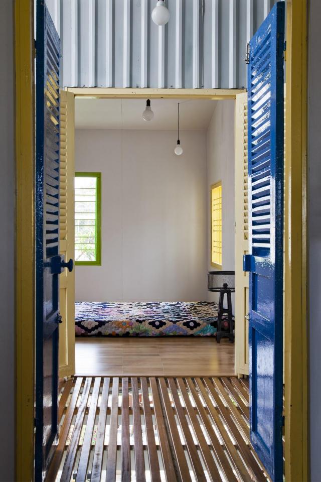 This small house in Vietnam has its ground floor living space open to the outdoors. It will eventually be covered by a screen of climbing plants. | www.facebook.com/SmallHouseBliss