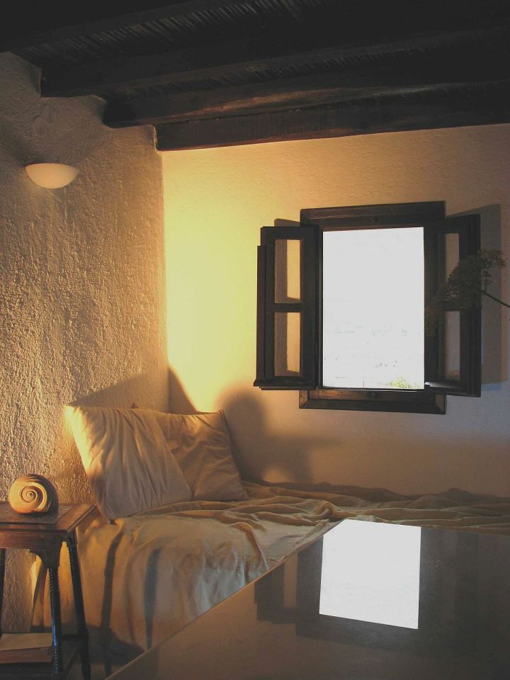 A traditional house on Mykonos was restored, staying true to the island's architectural history. It has two bedrooms and a loft in 840 sq ft. | www.facebook.com/SmallHouseBliss