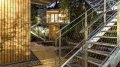 A pair of modern treehouses at the edge of a forest provide leafy retreats complete with kitchenette and bath. | www.facebook.com/SmallHouseBliss