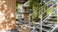 A pair of modern treehouses at the edge of a forest provide leafy retreats complete with kitchenette and bath. | www.facebook.com/SmallHouseBliss