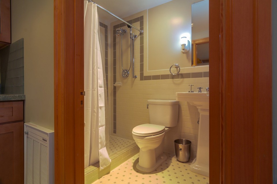 Though just 469 sq ft total, Susan's backyard cottage squeezes in spiral stairs to the loft bedroom. | www.facebook.com/SmallHouseBliss