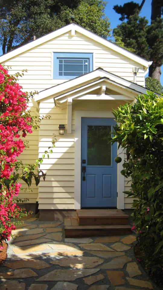 Though just 469 sq ft total, Susan's backyard cottage squeezes in spiral stairs to the loft bedroom. | www.facebook.com/SmallHouseBliss