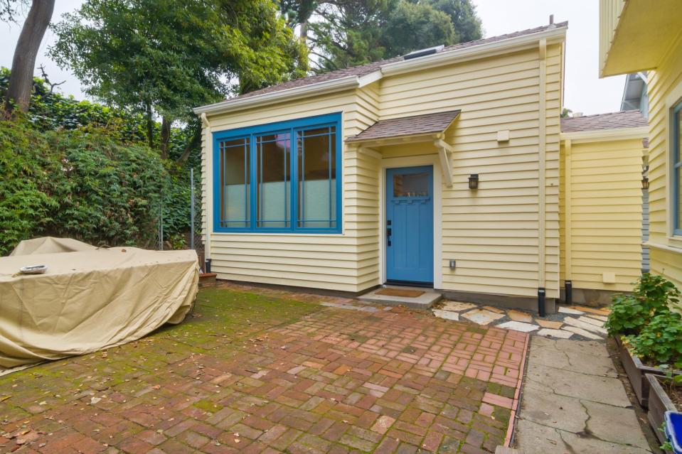 Though just 469 sq ft total, Susan's backyard cottage squeezes in spiral stairs to the loft bedroom. | www.facebook.com/SmallHouseBliss