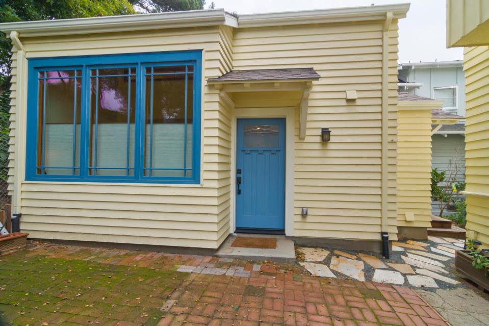 Though just 469 sq ft total, Susan's backyard cottage squeezes in spiral stairs to the loft bedroom. | www.facebook.com/SmallHouseBliss