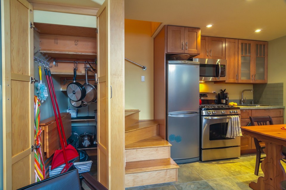 Though just 469 sq ft total, Susan's backyard cottage squeezes in spiral stairs to the loft bedroom. | www.facebook.com/SmallHouseBliss