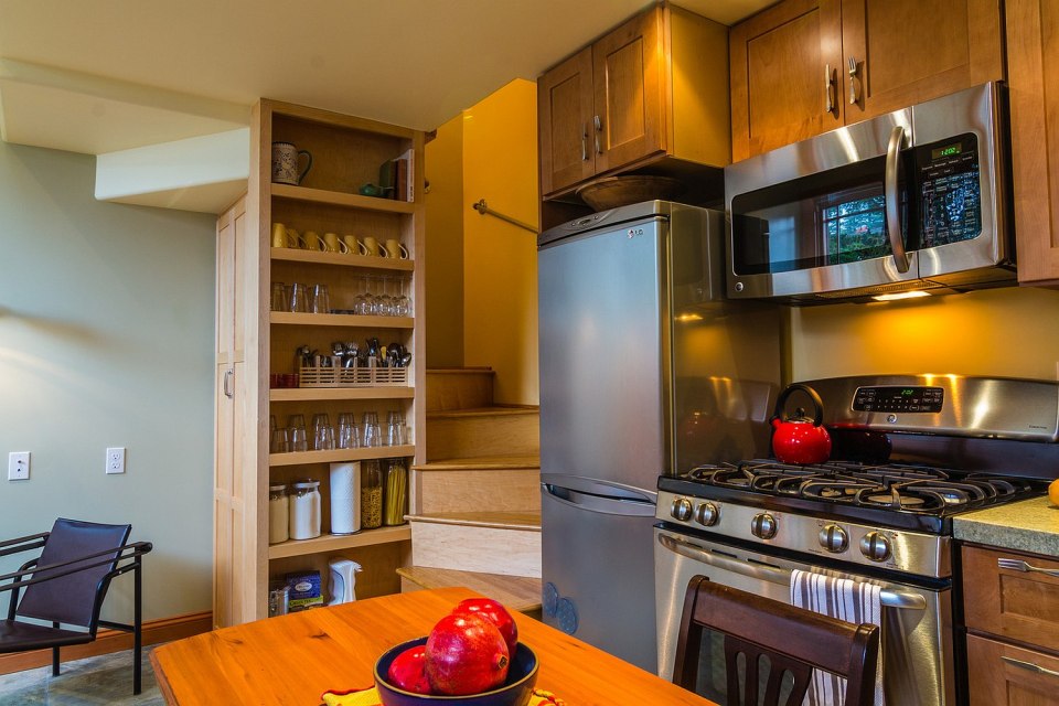 Though just 469 sq ft total, Susan's backyard cottage squeezes in spiral stairs to the loft bedroom. | www.facebook.com/SmallHouseBliss