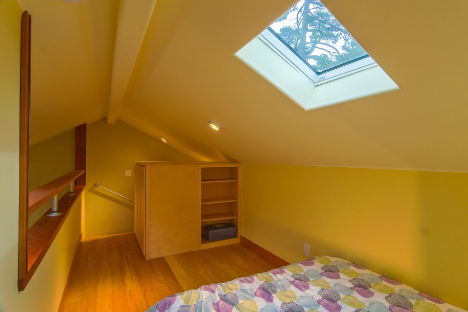 Though just 469 sq ft total, Susan's backyard cottage squeezes in spiral stairs to the loft bedroom. | www.facebook.com/SmallHouseBliss