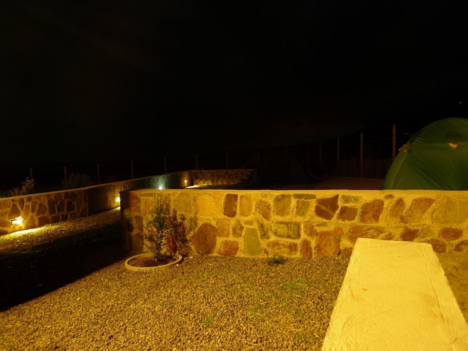 Located near a beach in Chile, this camping compound has a shipping container kitchen/bath, water tower and tent pads. | www.facebook.com/SmallHouseBliss