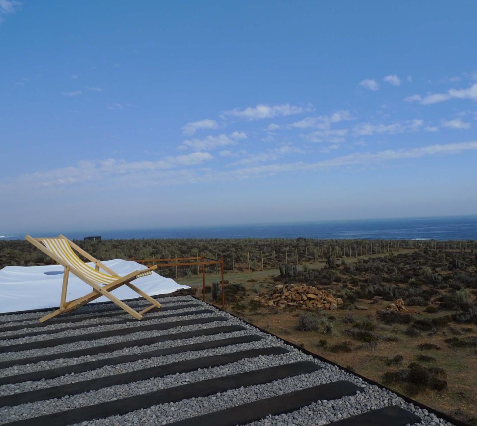 Located near a beach in Chile, this camping compound has a shipping container kitchen/bath, water tower and tent pads. | www.facebook.com/SmallHouseBliss