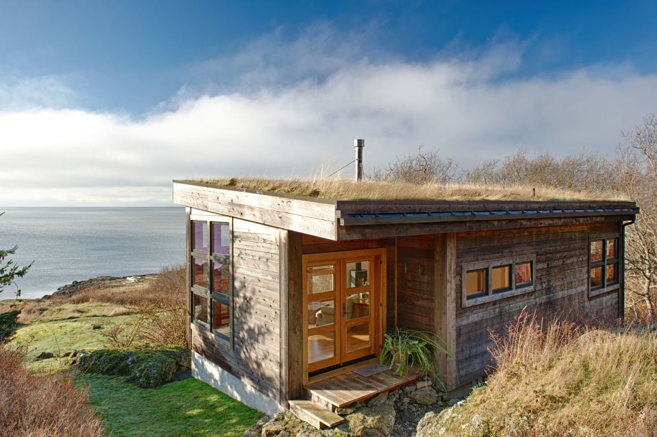 With a sod roof and weathered cedar siding, Eagle Point cabin blends with the San Juan Island landscape. It has 1 bedroom in 688 sq ft. | www.facebook.com/SmallHouseBliss