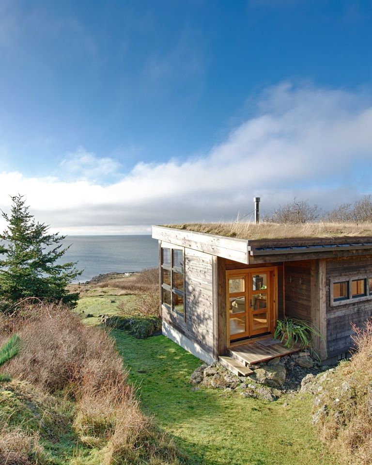 With a sod roof and weathered cedar siding, Eagle Point cabin blends with the San Juan Island landscape. It has 1 bedroom in 688 sq ft. | www.facebook.com/SmallHouseBliss