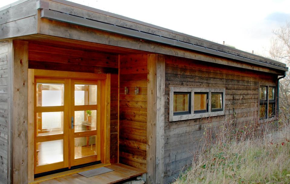 With a sod roof and weathered cedar siding, Eagle Point cabin blends with the San Juan Island landscape. It has 1 bedroom in 688 sq ft. | www.facebook.com/SmallHouseBliss