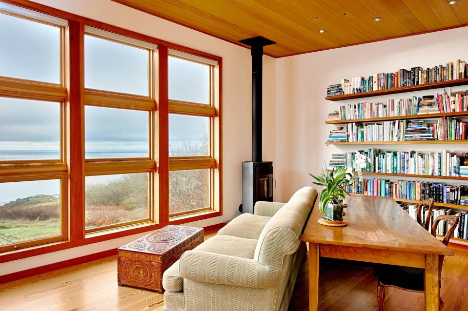 With a sod roof and weathered cedar siding, Eagle Point cabin blends with the San Juan Island landscape. It has 1 bedroom in 688 sq ft. | www.facebook.com/SmallHouseBliss