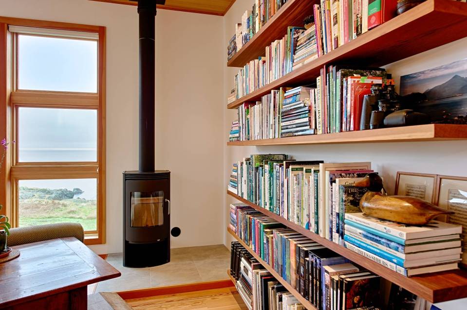 With a sod roof and weathered cedar siding, Eagle Point cabin blends with the San Juan Island landscape. It has 1 bedroom in 688 sq ft. | www.facebook.com/SmallHouseBliss
