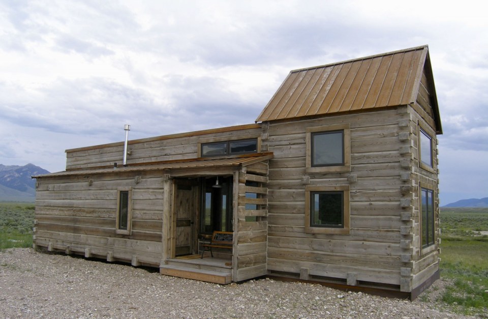 Little Lost Cabin, a small square-log cabin on 3,700 acres of Idaho ranchland. The 800 sq ft cabin has an open bedroom and a loft. | www.facebook.com/SmallHouseBliss