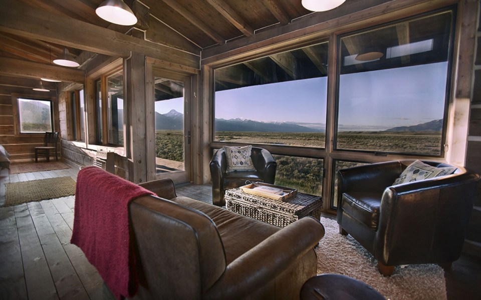 Little Lost Cabin, a small square-log cabin on 3,700 acres of Idaho ranchland. The 800 sq ft cabin has an open bedroom and a loft. | www.facebook.com/SmallHouseBliss