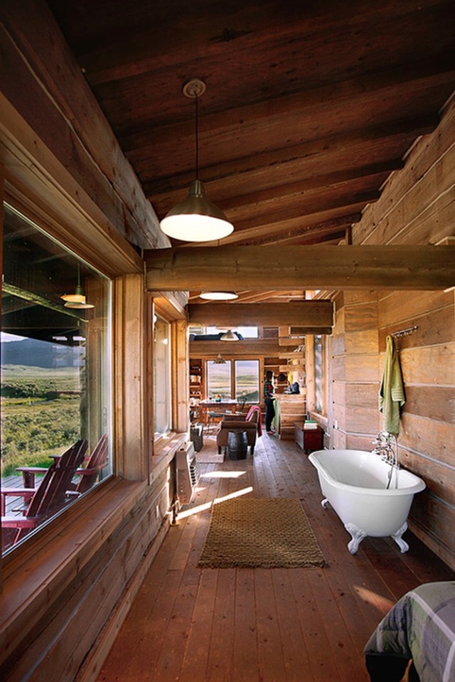 Little Lost Cabin, a small square-log cabin on 3,700 acres of Idaho ranchland. The 800 sq ft cabin has an open bedroom and a loft. | www.facebook.com/SmallHouseBliss