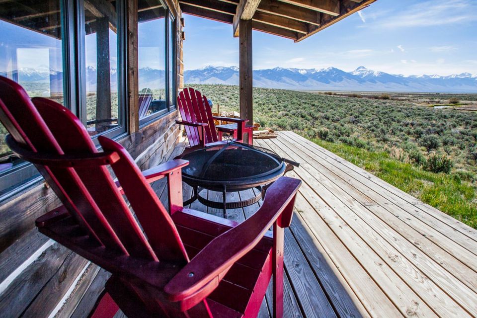 Little Lost Cabin, a small square-log cabin on 3,700 acres of Idaho ranchland. The 800 sq ft cabin has an open bedroom and a loft. | www.facebook.com/SmallHouseBliss