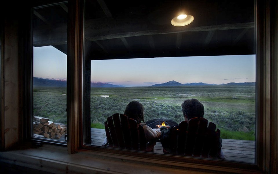 Little Lost Cabin, a small square-log cabin on 3,700 acres of Idaho ranchland. The 800 sq ft cabin has an open bedroom and a loft. | www.facebook.com/SmallHouseBliss