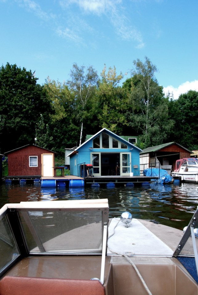 An old float house moored along a Prague riverbank was given a contemporary redesign. | www.facebook.com/SmallHouseBliss