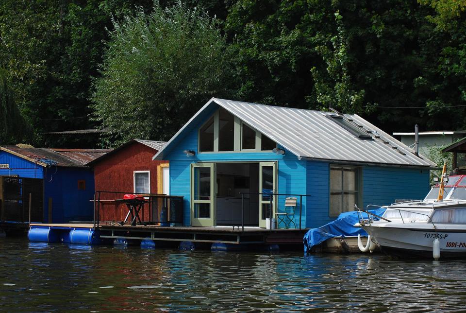 An old houseboat moored along a Prague riverbank was given a contemporary redesign. | www.facebook.com/SmallHouseBliss