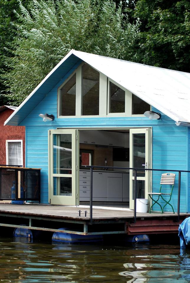 An old float house moored along a Prague riverbank was given a contemporary redesign. | www.facebook.com/SmallHouseBliss