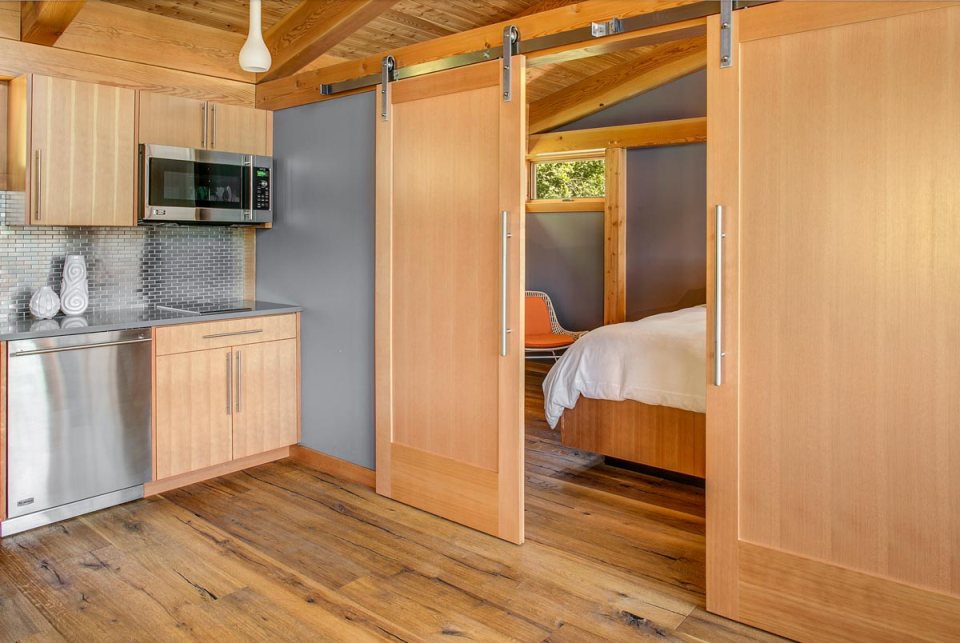 This timber framed cabin has modern lines and an energy-efficient shell. There is 1 bedroom in 550 sq ft. | www.facebook.com/SmallHouseBliss