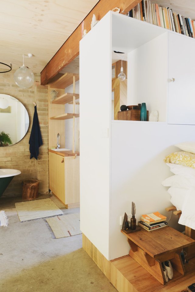 A detached two-car garage was transformed into this bright and roomy backyard cottage with a studio floor plan. | www.facebook.com/SmallHouseBliss