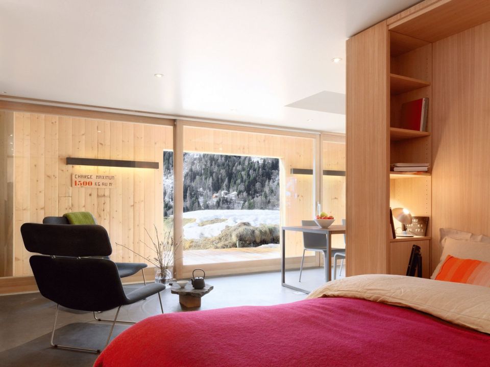 A WW II-era munitions storage building in the Swiss Alps was converted into this modern cabin with a 527 sq ft studio floor plan. | www.facebook.com/SmallHouseBliss
