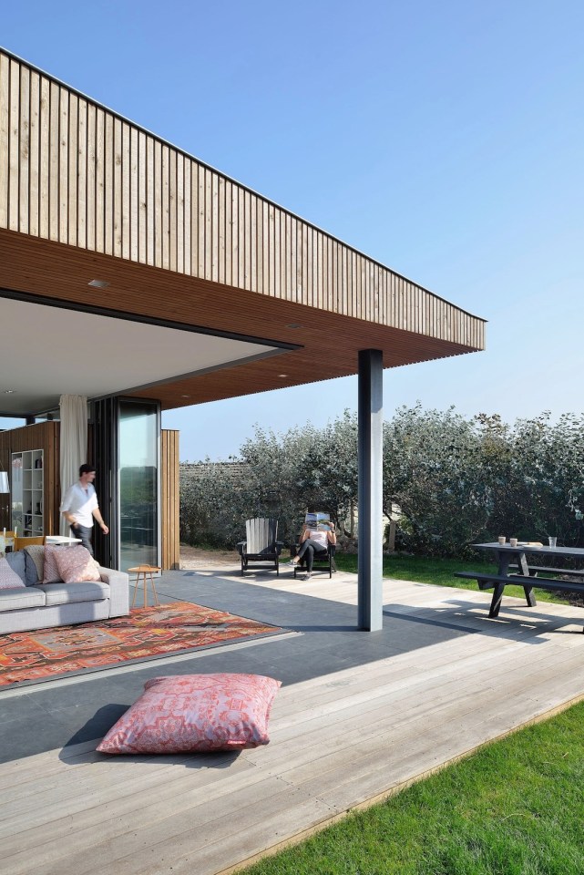 This vacation cottage sits on the sand dunes of a Dutch coastal island. It has two small bedrooms in 646 sq ft. | www.facebook.com/SmallHouseBliss