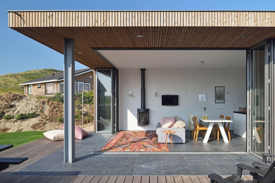 This vacation cottage sits on the sand dunes of a Dutch coastal island. It has two small bedrooms in 646 sq ft. | www.facebook.com/SmallHouseBliss